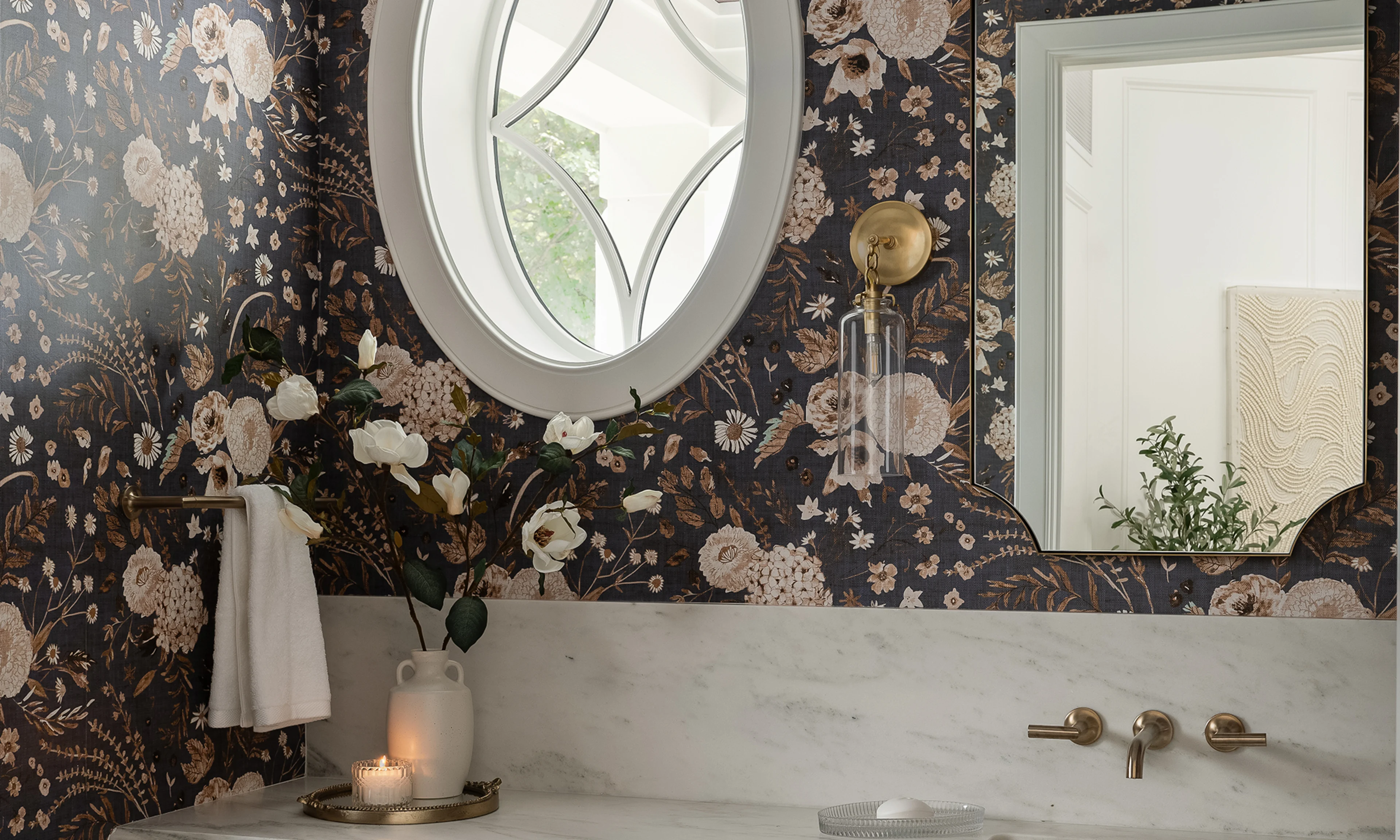 Bathroom with grey floral wallpaper.