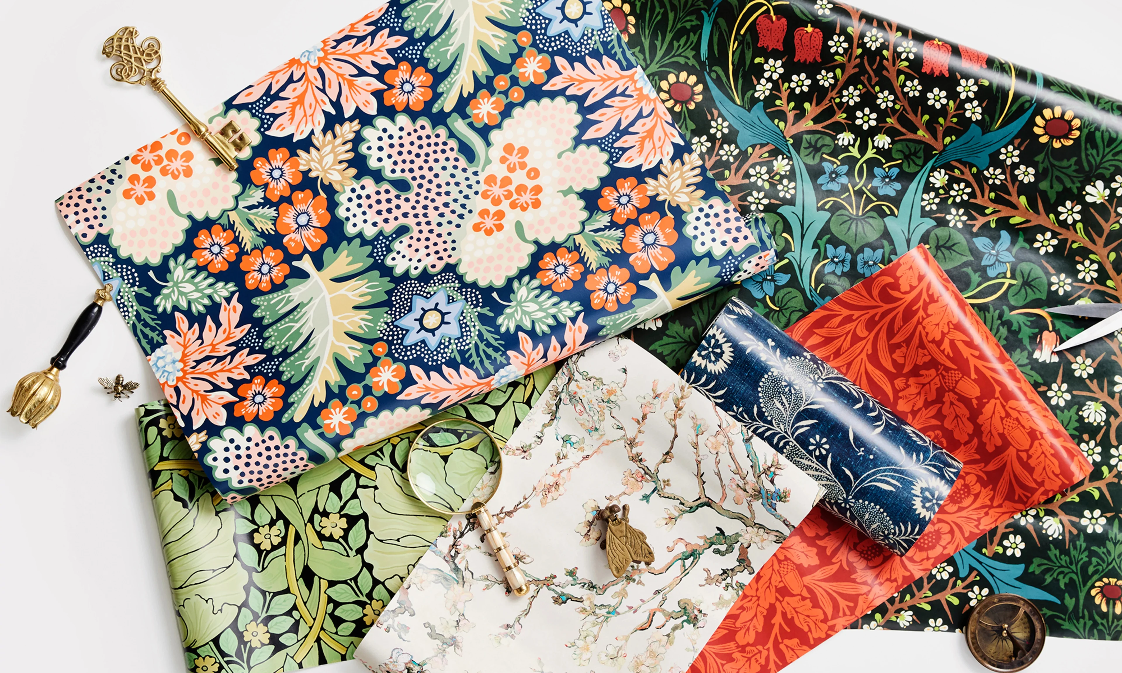 Heritage revival style peel and stick wallpaper rolls and swatches.