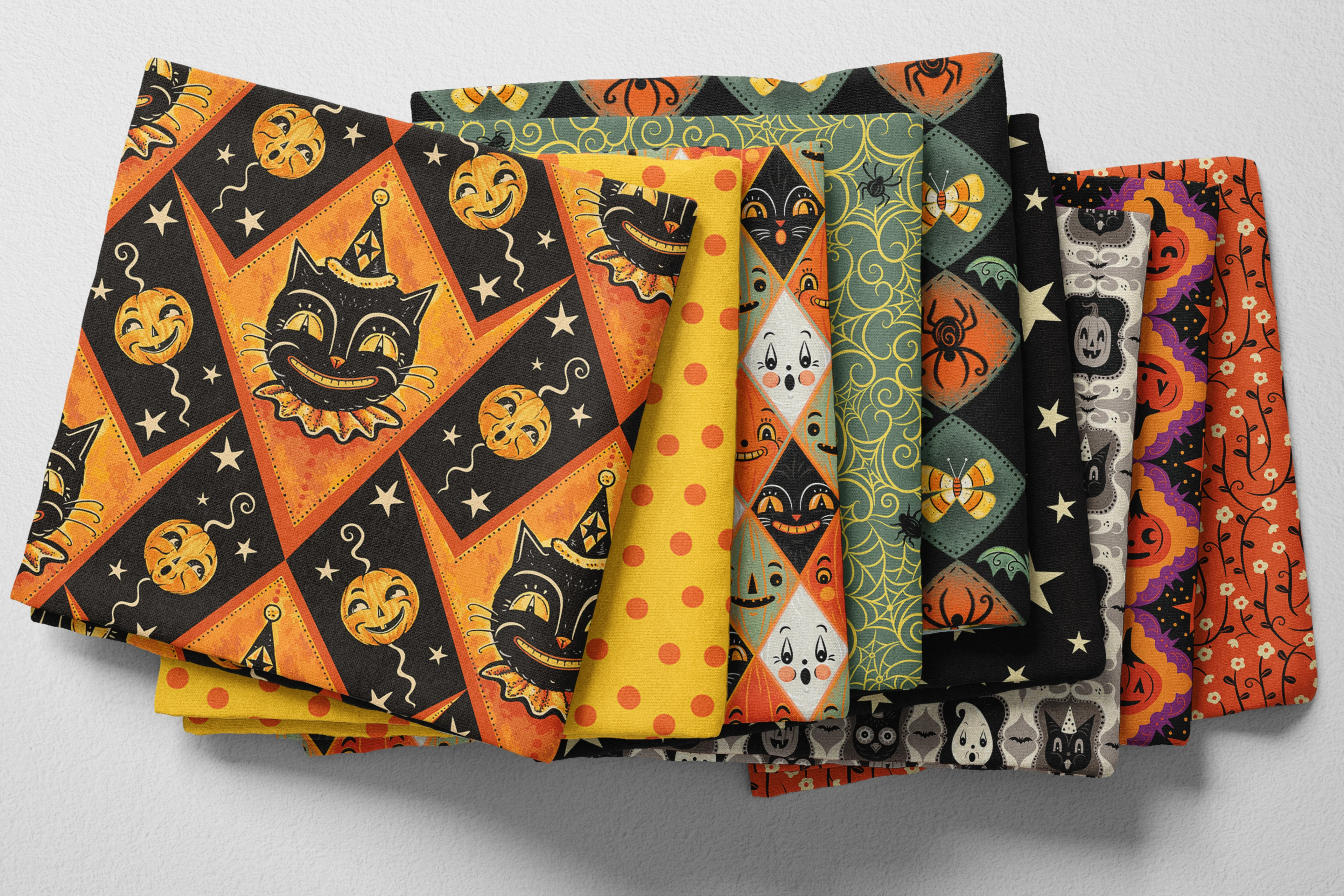 Colorful folded Spoonflower fabric with a bright retro Halloween theme