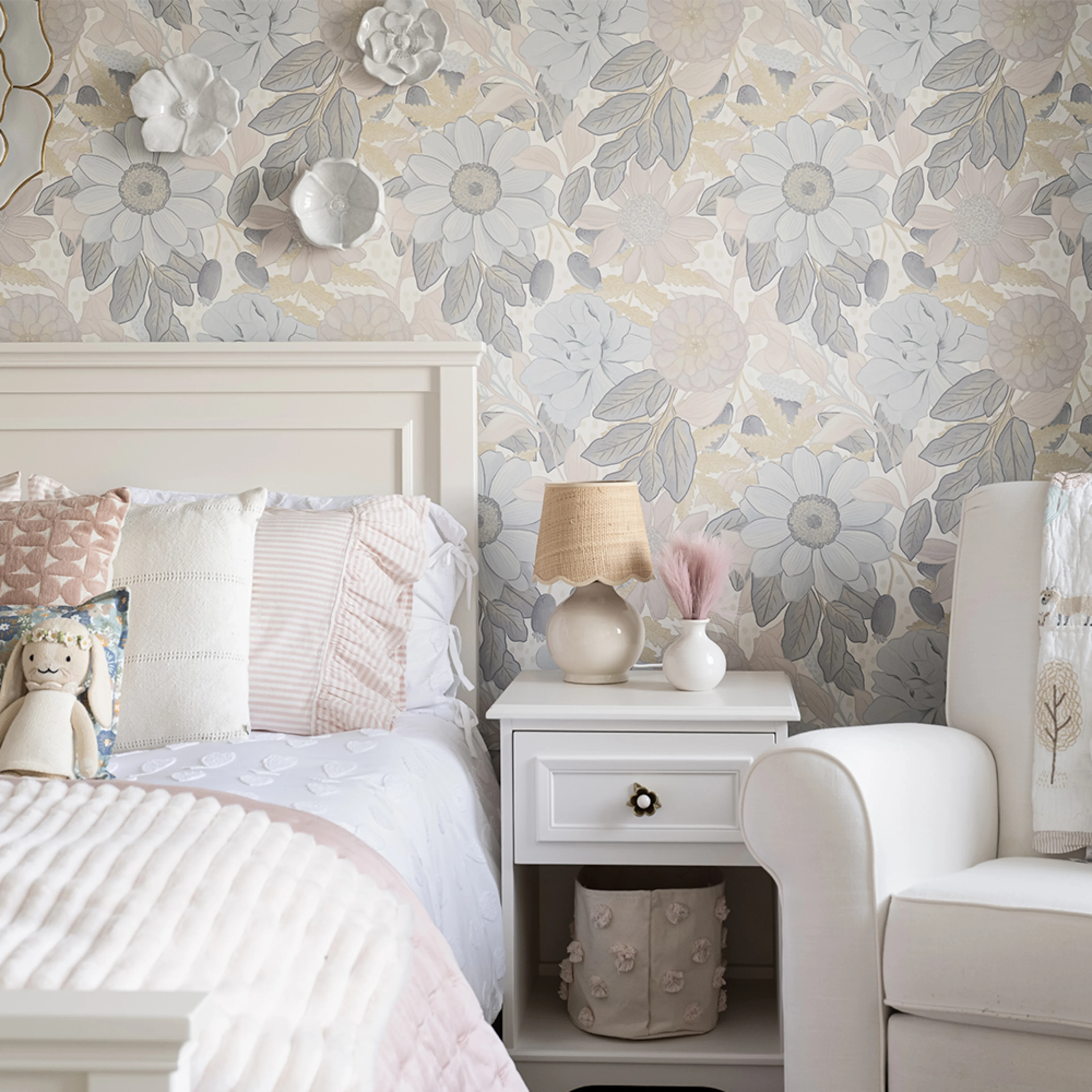 Kids room with large neutral floral peel and stick wallpaper.