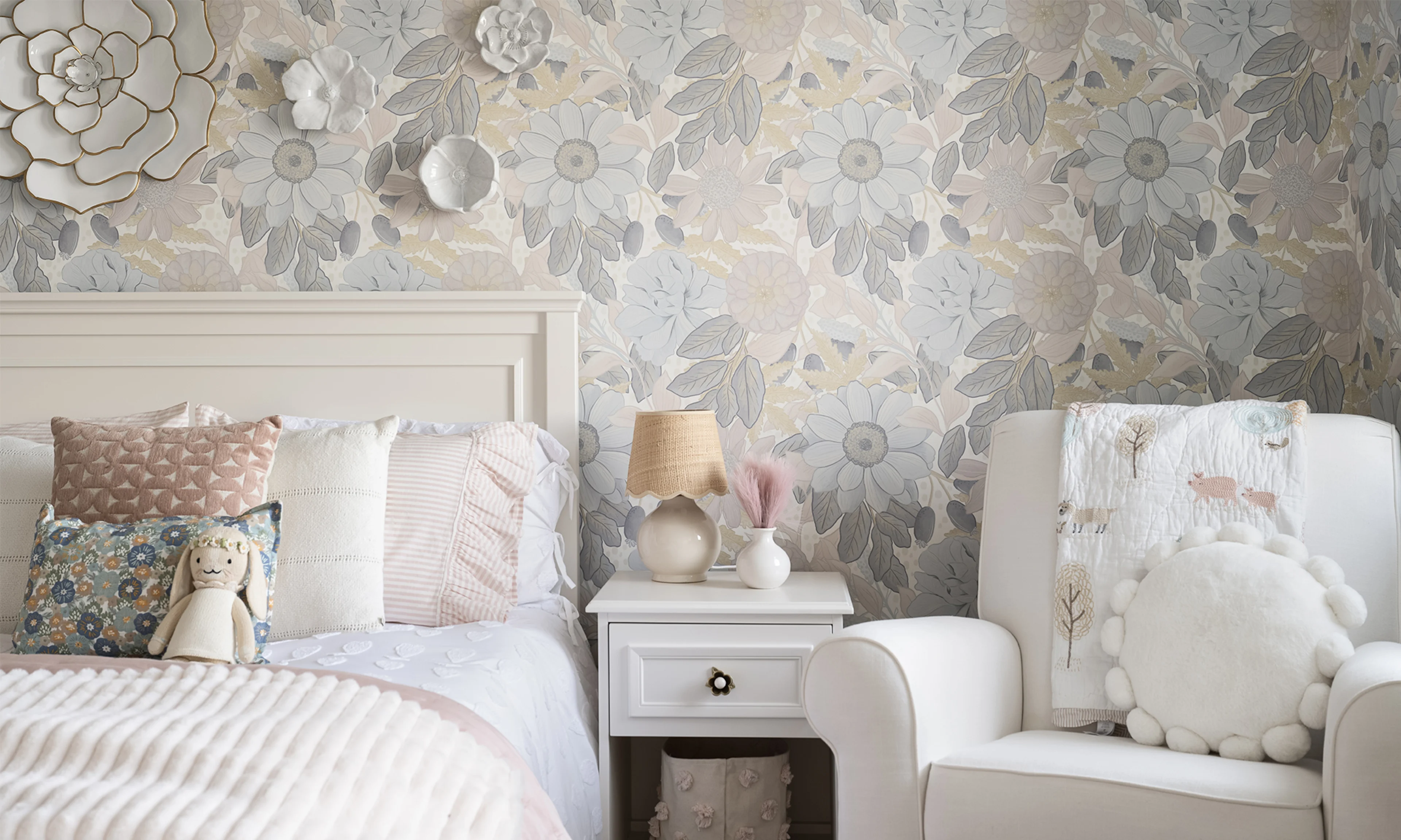Kids room with large neutral floral peel and stick wallpaper.