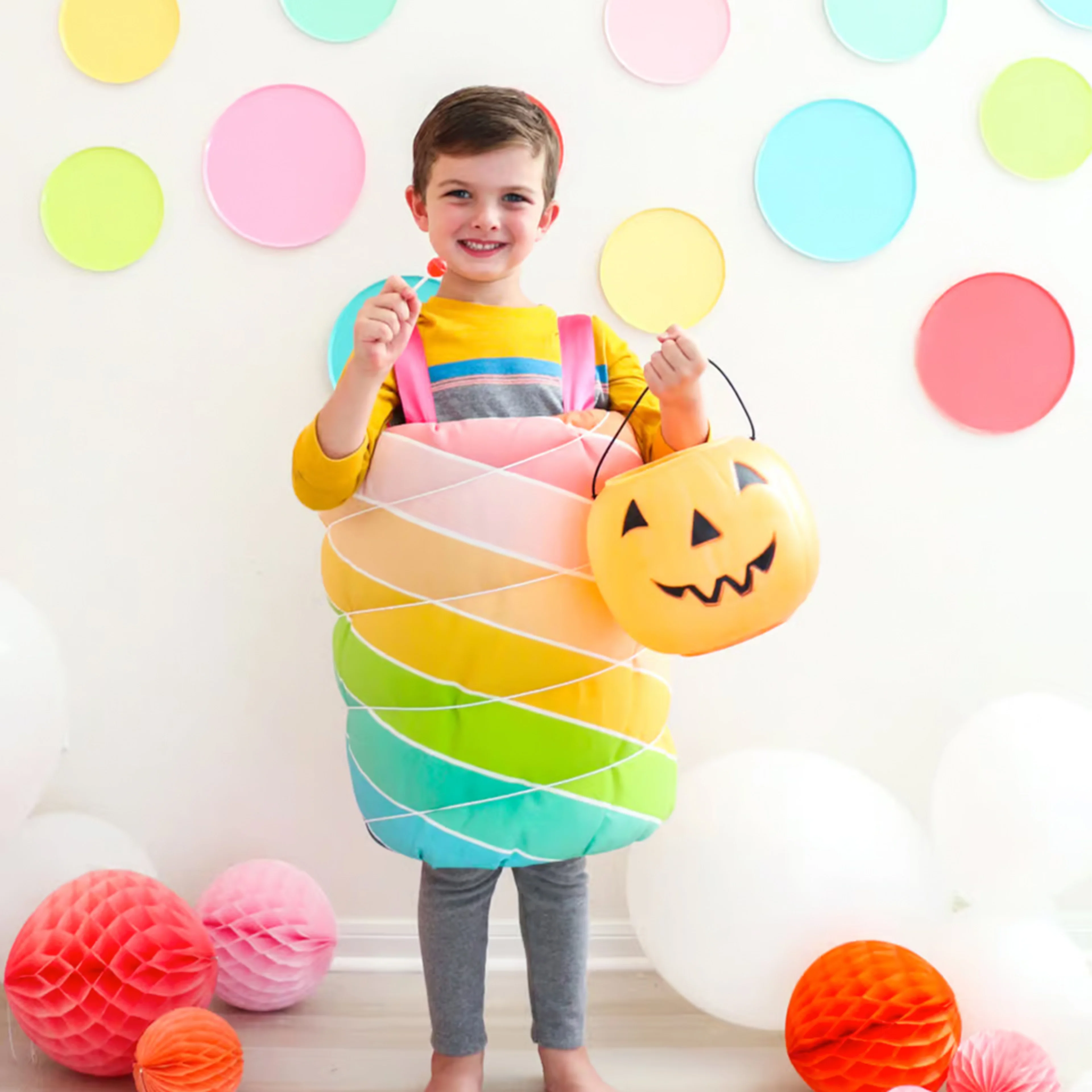 Little kid in a lolipop costume.