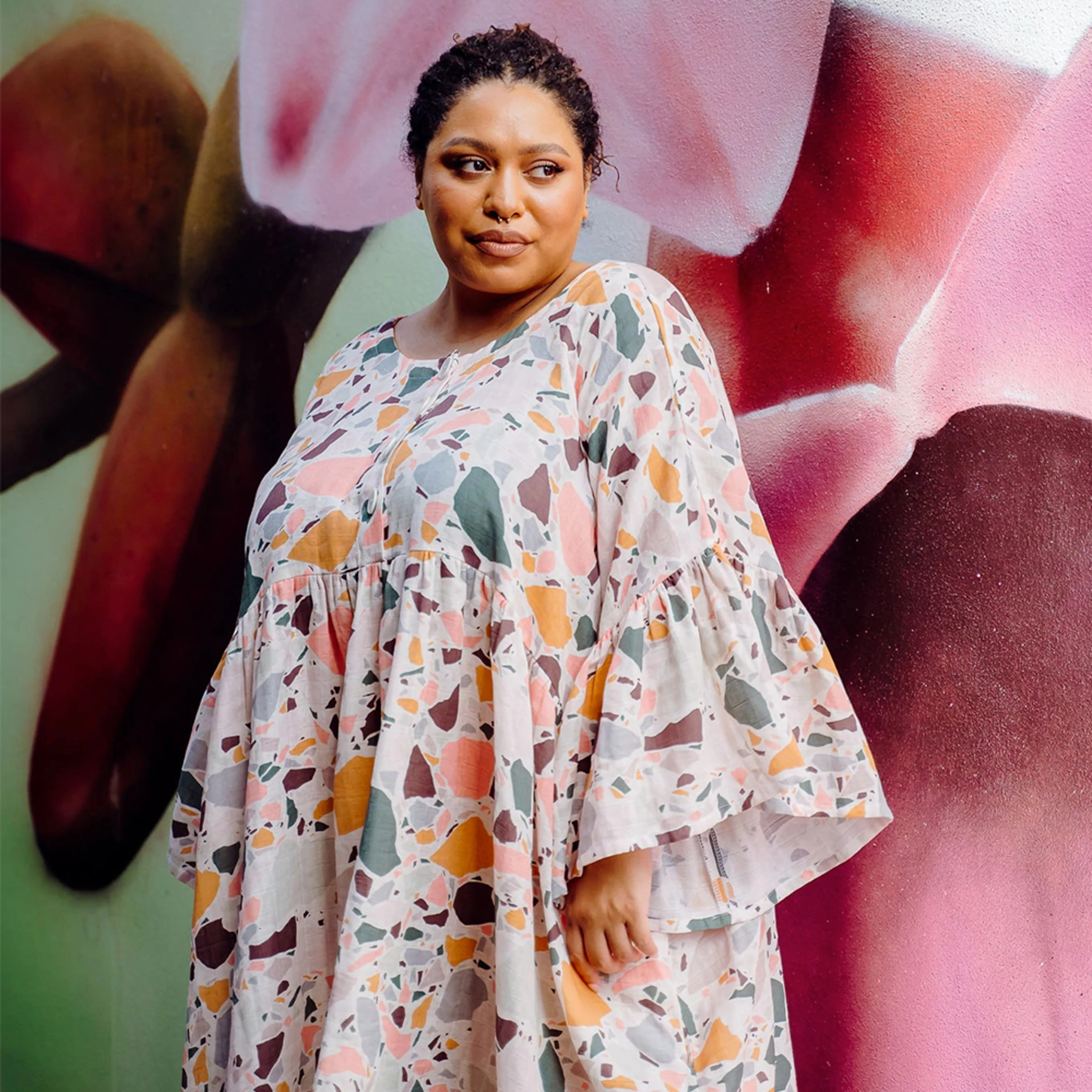 Woman in terrazzo print dress.peppermint magazine bowen dress